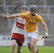 28 June 2009; Matthew Donnelly, Anrtrim, in action against Gavin O'Neill, Derry. ESB Ulster Minor Hurling Championship Final, Anrtrim v Derry, Casement Park, Belfast, Co. Antrim. Picture credit: Oliver McVeigh / SPORTSFILE