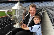 1 July 2009; The Bob O'Keeffe Cup, TV3 hurling panellist Daithi Regan and Oscar Holden, 2 and 1/2 years, at the TV3 Silverware Sunday photocall. Croke Park, Dublin. Picture credit: Ray McManus / SPORTSFILE