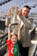 1 July 2009; Five-year-old Chloe Danton with TV3 football panellist Senan Connell and the Munster Championship Cup at the TV3 Silverware Sunday photocall. Croke Park, Dublin. Picture credit: Ray McManus / SPORTSFILE