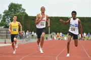 28 June 2009; Stephen Colvert, Crusaders AC, crosses the finish line ahead of Seye Ogunlewe, Celbridge AC, right, and Oliver Back, Celbridge, left, to win the Junior Men's 100m Final at event at the AAI Woodies DIY Junior & U23 Track & Field Championships, Tullamore, Co. Offaly. Picture credit: Pat Murphy / SPORTSFILE