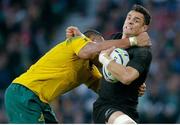 31 October 2015; New Zealand's Dan Carter is tackled by Sekope Kepu, Australia. 2015 Rugby World Cup Final, New Zealand v Australia. Twickenham Stadium, Twickenham, London, England. Picture credit: Roberto Bregani / SPORTSFILE
