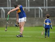 1 November 2015; A dejected Willie Hyland, Clough Ballacolla, and supporter Conor Saunders, age 7, at the end of the game. AIB Leinster GAA Hurling Senior Club Championship, Quarter-Final, Clough Ballacolla v Oulart the Ballagh. O'Moore Park, Portlaoise, Co. Laois. Picture credit: David Maher / SPORTSFILE