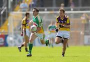 4 July 2009; Thomas Deenan, Offaly, in action against Niall Murphy, Wexford. GAA All-Ireland Senior Football Championship Qualifier, Round 1, Wexford v Offaly, Wexford Park, Wexford. Picture credit: Ray McManus / SPORTSFILE