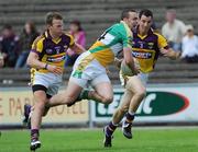4 July 2009; P.J. Ward, Offaly, in action against Niall Murphy, left, and Graeme Molloy, Wexford. GAA All-Ireland Senior Football Championship Qualifier, Round 1, Wexford v Offaly, Wexford Park, Wexford. Picture credit: Ray McManus / SPORTSFILE