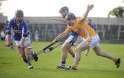 4 July 2009; Eamon Jackman, left, and John Brophy, Laois, in action against Neil McAuley, Antrim. GAA Hurling All-Ireland Senior Championship, Phase 1, Laois v Antrim, O'Moore Park, Portlaoise, Co. Laois. Picture credit: Stephen McCarthy / SPORTSFILE