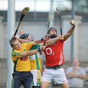 4 July 2009; Aisake O hAilpin, Cork, catches the sliothar ahead of goalkeeper Brian Mullins and Paul Cleary, Offaly. GAA Hurling All-Ireland Senior Championship Qualifier, Phase 1, Offaly v Cork, O'Connor Park, Tullamore, Co. Offaly. Picture credit: Brendan Moran / SPORTSFILE