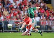 5 July 2009; Stephen Lavin, Limerick, shoots for goal despite the challenge of Patrick Kelly, Cork. GAA Football Munster Senior Championship Final, Limerick v Cork, Pairc Ui Chaoimh, Cork. Picture credit: Brendan Moran / SPORTSFILE