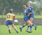 4 July 2009; Waterford's Mary Foley, left, and Michelle Ryan clash heads as Clare's Rachel Lenihan wins possession for her team. TG4 Ladies Football Munster Intermediate Championship Final, Clare v Waterford, Bruff, Co. Limerick. Picture credit: Diarmuid Greene / SPORTSFILE