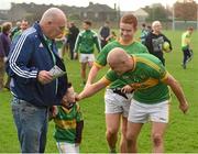 1 November 2015; Ian Barnes, right, and Luke Moore, Clonmel Commercials, celebrate with 5-year-old Leon Kelly along with his grandfather Franny Kelly, after their side's victory. AIB Munster GAA Senior Club Football Championship Quarter-Final, Clonmel Commercials v Newcastlewest. Clonmel Sportsfield, Clonmel, Co. Tipperary. Picture credit: Diarmuid Greene / SPORTSFILE