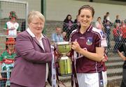 5 July 2009; Galway captain Annette Clarke accepts the CBE cup from Geraldine Carey, President Connacht Council. TG4 Ladies Football Connacht Senior Championship Final, Mayo v Galway, O’Hara’s Pitch, Charlestown, Co. Mayo. Photo by Sportsfile
