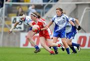 5 July 2009; Lynda Donnelly, Tyrone, in action against Niamh Kindlan and Ciara McAnespie, Monaghan. TG4 Ladies Football Ulster Senior Championship Final, Monaghan v Tyrone, Breffini Park, Cavan. Picture credit: Oliver McVeigh / SPORTSFILE