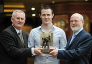 8 July 2009; Antrim footballer Michael McCann is presented with the Vodafone GAA Player of the Month Award for June by Uachtarán Chumann Lúthchleas Gael Criostóir Ó Cuana, left, and Gerry Fahy, Director of Strategy, Vodafone Ireland. Waterford's John Mullane received the Vodafone GAA Player of the Month Award for Hurling. Westbury Hotel, Dublin. Picture credit: Brian Lawless / SPORTSFILE