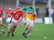 4 July 2009; Joe Brady, Offaly, in a race for possession with Ronan Curran, Cork. GAA Hurling All-Ireland Senior Championship Qualifier, Phase 1, Offaly v Cork, O'Connor Park, Tullamore, Co. Offaly. Picture credit: Brendan Moran / SPORTSFILE