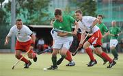 9July 2009; John Jermyn, Ireland, in action against Tomasz Dutkiewicz, left, and Miroslaw Juszczak, Poland. FIH Champions Challenge II, Ireland v Poland, National Hockey Stadium, UCD, Belfield, Dublin. Picture credit: Brendan Moran / SPORTSFILE