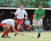 9July 2009; David Hobbs, Ireland, in action against Bartosz Zywiczka, Poland. FIH Champions Challenge II, Ireland v Poland, National Hockey Stadium, UCD, Belfield, Dublin. Picture credit: Brendan Moran / SPORTSFILE