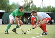 9July 2009; Stephen Butler, Ireland, in action against Bartosz Zywiczka, Poland. FIH Champions Challenge II, Ireland v Poland, National Hockey Stadium, UCD, Belfield, Dublin. Picture credit: Brendan Moran / SPORTSFILE