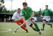 9July 2009; Geoff McCabe, Ireland, in action against Tomasz Dutkiewicz, Poland. FIH Champions Challenge II, Ireland v Poland, National Hockey Stadium, UCD, Belfield, Dublin. Picture credit: Brendan Moran / SPORTSFILE