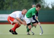 9July 2009; John Jackson, Ireland, in action against Tomasz Choczaj, Poland. FIH Champions Challenge II, Ireland v Poland, National Hockey Stadium, UCD, Belfield, Dublin. Picture credit: Brendan Moran / SPORTSFILE