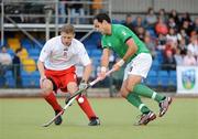 9July 2009; Stephen Butler, Ireland, in action against Miroslaw Juszczak, Poland. FIH Champions Challenge II, Ireland v Poland, National Hockey Stadium, UCD, Belfield, Dublin. Picture credit: Brendan Moran / SPORTSFILE