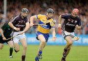 11 July 2009; Niall Gilligan, Clare, in action against Adrian Cullinane and John Lee, Galway. GAA Hurling All-Ireland Senior Championship, Phase 2, Clare v Galway, Cusack Park, Ennis, Co. Clare. Picture credit: Ray Ryan / SPORTSFILE