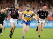 11 July 2009; Niall Gilligan, Clare, in action against Adrian Cullinane and John Lee, Galway. GAA Hurling All-Ireland Senior Championship, Phase 2, Clare v Galway, Cusack Park, Ennis, Co. Clare. Picture credit: Ray Ryan / SPORTSFILE
