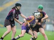 11 July 2009; Kate Kelly, Wexford, in action against Lorraine Ryan, left, and Ann-Marie Hayes, Galway. Gala Senior Camogie Championship, Group 2, Round 2, Wexford Park, Wexford. Picture credit: Matt Browne / SPORTSFILE