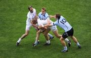 12 July 2009; Daryl Flynn supported by his Kildare team-mate Dermot Earley is tackled by Dublin's Paul Griffin and Paul Flynn. GAA Football Leinster Senior Championship Final, Dublin v Kildare, Croke Park, Dublin. Picture credit: Ray McManus / SPORTSFILE