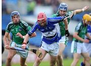 18 July 2009; Owen Holohan, Laois, in action against Gavin O'Mahoney, left, and Stephen Lucey, Limerick. GAA All-Ireland Senior Hurling Championship, Phase 3, Laois v Limerick, Semple Stadium, Thurles, Co. Tipperary. Picture credit: Brian Lawless / SPORTSFILE