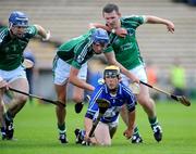 18 July 2009; Colin Delaney, Laois, in action against, from left, Stephen Lucey, Gavin O'Mahoney, and Mark Foley, Limerick. GAA All-Ireland Senior Hurling Championship, Phase 3, Laois v Limerick, Semple Stadium, Thurles, Co. Tipperary. Picture credit: Brian Lawless / SPORTSFILE