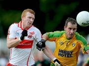 18 July 2009; Fergal Doherty, Derry, in action against Barry Monaghan, Donegal. GAA All-Ireland Senior Football Championship Qualifier, Round 3, Donegal v Derry, MacCumhaill Park, Ballybofey, Co. Donegal. Picture credit: Oliver McVeigh / SPORTSFILE