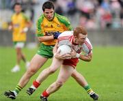 18 July 2009; Fergal Doherty, Derry, in action against Kevin Cassidy, Donegal. GAA All-Ireland Senior Football Championship Qualifier, Round 3, Donegal v Derry, MacCumhaill Park, Ballybofey, Co. Donegal. Picture credit: Oliver McVeigh / SPORTSFILE