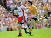 19 July 2009; Kevin Hughes, Tyrone, in action against Niall McKeever, Antrim. GAA Football Ulster Senior Championship Final, Tyrone v Antrim, St Tighearnach's Park, Clones, Co. Monaghan. Picture credit: Brian Lawless / SPORTSFILE