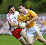 19 July 2009; Conor Gormley, Tyrone, in action against Sean Burke, Antrim. GAA Football Ulster Senior Championship Final, Tyrone v Antrim, St Tighearnach's Park, Clones, Co. Monaghan. Picture credit: Michael Cullen / SPORTSFILE