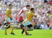 19 July 2009; Tony Scullion, Antrim, in action against Stephen O'Neill, Tyrone. GAA Football Ulster Senior Championship Final, Tyrone v Antrim, St Tighearnach's Park, Clones, Co. Monaghan. Picture credit: Brian Lawless / SPORTSFILE