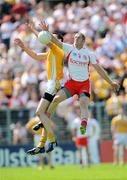 19 July 2009; Kevin Hughes, Tyrone, in action against Niall McKeever, Antrim. GAA Football Ulster Senior Championship Final, Tyrone v Antrim, St Tighearnach's Park, Clones, Co. Monaghan. Picture credit: Brian Lawless / SPORTSFILE