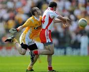 19 July 2009; Colin Brady, Antrim, tackles Stephen O'Neill, Tyrone. GAA Football Ulster Senior Championship Final, Tyrone v Antrim, St Tighearnach's Park, Clones, Co. Monaghan. Picture credit: Brian Lawless / SPORTSFILE