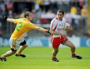 19 July 2009; Stephen O'Neill, Tyrone, in action against Colin Brady, Antrim. GAA Football Ulster Senior Championship Final, Tyrone v Antrim, St Tighearnach's Park, Clones, Co. Monaghan. Picture credit: Brian Lawless / SPORTSFILE