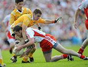 19 July 2009; Stephen O'Neill, Tyrone, in action against Tony Scullion and Kevin O'Boyle, left, Antrim. GAA Football Ulster Senior Championship Final, Tyrone v Antrim, St Tighearnach's Park, Clones, Co. Monaghan. Picture credit: Brian Lawless / SPORTSFILE
