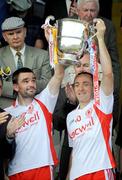 19 July 2009; Tyrone captain Brian Dooher, left, and team-mate Ryan McMenamin lift the cup. GAA Football Ulster Senior Championship Final, Tyrone v Antrim, St Tighearnach's Park, Clones, Co. Monaghan. Picture credit: Brian Lawless / SPORTSFILE