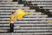 19 July 2009; A lone Antrim fan rolls up his flag after the match. GAA Football Ulster Senior Championship Final, Tyrone v Antrim, St Tighearnach's Park, Clones, Co. Monaghan. Picture credit: Brian Lawless / SPORTSFILE