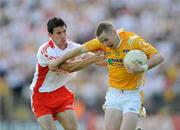 19 July 2009; Paddy Cunningham, Antrim, in action against PJ Quinn, Tyrone. GAA Football Ulster Senior Championship Final, Tyrone v Antrim, St Tighearnach's Park, Clones, Co. Monaghan. Picture credit: Brian Lawless / SPORTSFILE