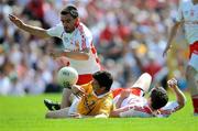 19 July 2009; Ryan McMenamin, left, and Enda McGinley, Tyrone, in action against Tomas McCann, Antrim. GAA Football Ulster Senior Championship Final, Tyrone v Antrim, St Tighearnach's Park, Clones, Co. Monaghan. Picture credit: Brian Lawless / SPORTSFILE