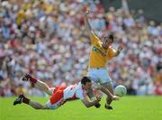 19 July 2009; Kevin Hughes, Tyrone, in action against Kevin Niblock, Antrim. GAA Football Ulster Senior Championship Final, Tyrone v Antrim, St Tighearnach's Park, Clones, Co. Monaghan. Picture credit: Brian Lawless / SPORTSFILE