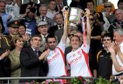 19 July 2009; Tyrone captain Brian Dooher, right, and team-mate Ryan McMenamin  lift the Anglo Celt cup. GAA Football Ulster Senior Championship Final, Tyrone v Antrim, St Tighearnach's Park, Clones, Co. Monaghan. Picture credit: Oliver McVeigh / SPORTSFILE
