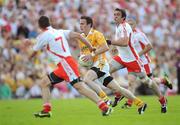 19 July 2009; Michael McCann, Antrim, in action against Philip Jordan, left, and Joe McMahon, Tyrone. GAA Football Ulster Senior Championship Final, Tyrone v Antrim, St Tighearnach's Park, Clones, Co. Monaghan. Picture credit: Brian Lawless / SPORTSFILE