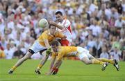 19 July 2009; Ryan McMenamin, Tyrone, in action against Michael McCann and James Loughrey, Antrim. GAA Football Ulster Senior Championship Final, Tyrone v Antrim, St Tighearnach's Park, Clones, Co. Monaghan. Picture credit: Oliver McVeigh / SPORTSFILE