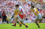 19 July 2009; Sean Cavanagh, Tyrone, goes past Antrim's Andy McClean on the way to score his side's first goal. GAA Football Ulster Senior Championship Final, Tyrone v Antrim, St Tighearnach's Park, Clones, Co. Monaghan. Picture credit: Brian Lawless / SPORTSFILE