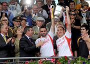 19 July 2009; Ryan McMenamin and Brian Dooher, Tyrone, lift the Anglo Celt cup. GAA Football Ulster Senior Championship Final, Tyrone v Antrim, St Tighearnach's Park, Clones, Co. Monaghan. Picture credit: Oliver McVeigh / SPORTSFILE