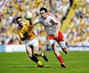 19 July 2009; Colm Cavanagh, Tyrone, in action against Tony Scullion, Antrim. GAA Football Ulster Senior Championship Final, Tyrone v Antrim, St Tighearnach's Park, Clones, Co. Monaghan. Picture credit: Michael Cullen / SPORTSFILE