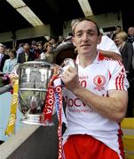 19 July 2009; Tyrone captain Brian Dooher with the Anglo Celt Cup. GAA Football Ulster Senior Championship Final, Tyrone v Antrim, St Tighearnach's Park, Clones, Co. Monaghan. Picture credit: Michael Cullen / SPORTSFILE